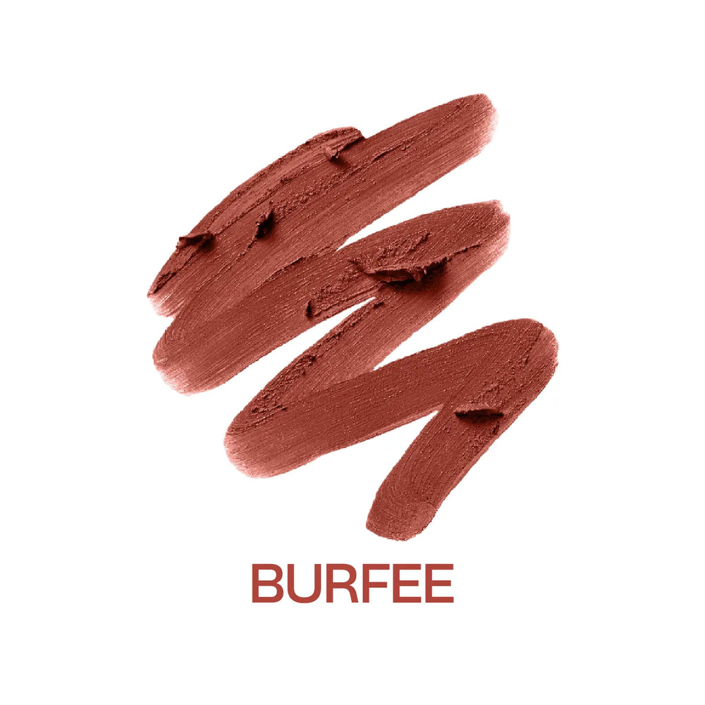 Macro close-up of MyHues Smudgestix Burfee warm nude brown lipstick gliding smoothly across rich creamy pigment. Soft matte bullet lipstick featuring one-swipe colour payoff, buildable coverage, effortless application, and blendable lip and cheek colour.
