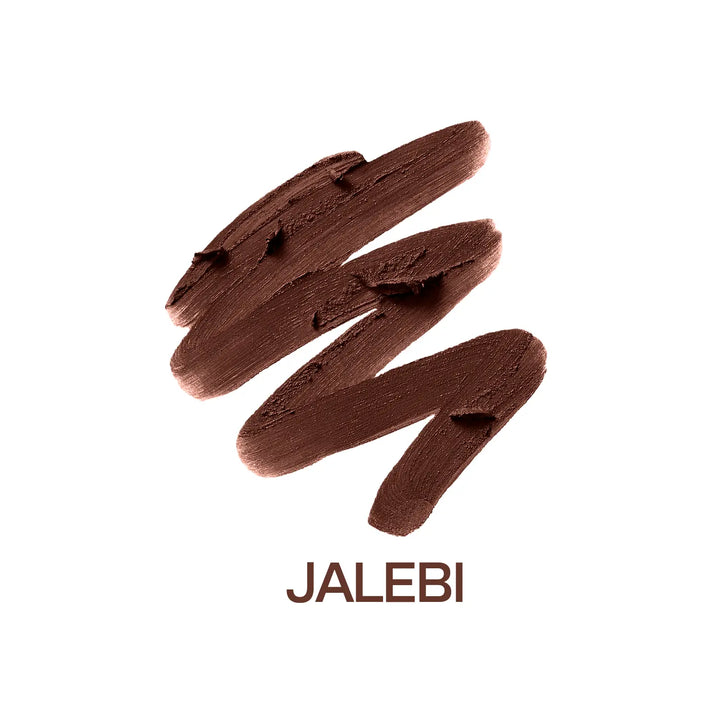 Macro close-up of MyHues Smudgestix Jalebi deep warm brown lipstick gliding smoothly across rich creamy pigment. Soft matte bullet lipstick with one-swipe colour payoff, buildable coverage, effortless application, and a blendable lip and cheek formula for everyday makeup.