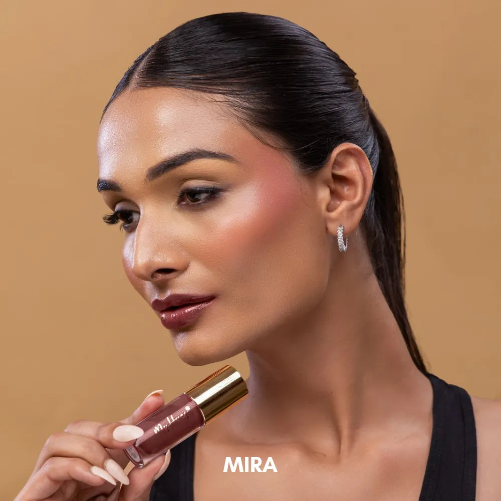 MyHues HyGlow Lip Elixir Tara shade swatch featuring a glossy light nude pink lip oil and lip gloss hybrid. Highly pigmented formula provides high-shine colour, smooth application, lightweight hydration and comfortable wear while helping cover dark or pigmented lips.