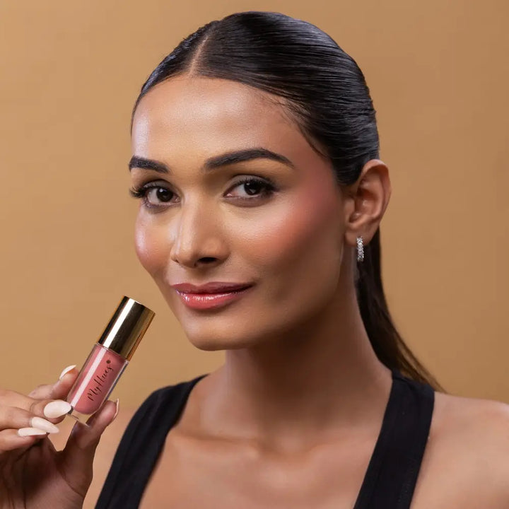 MyHues HyGlow Lip Elixir in Tara – light pink lip gloss on medium Indian skin tone, high shine hydrating lip gloss with rich pigmentation and non sticky glossy finish
