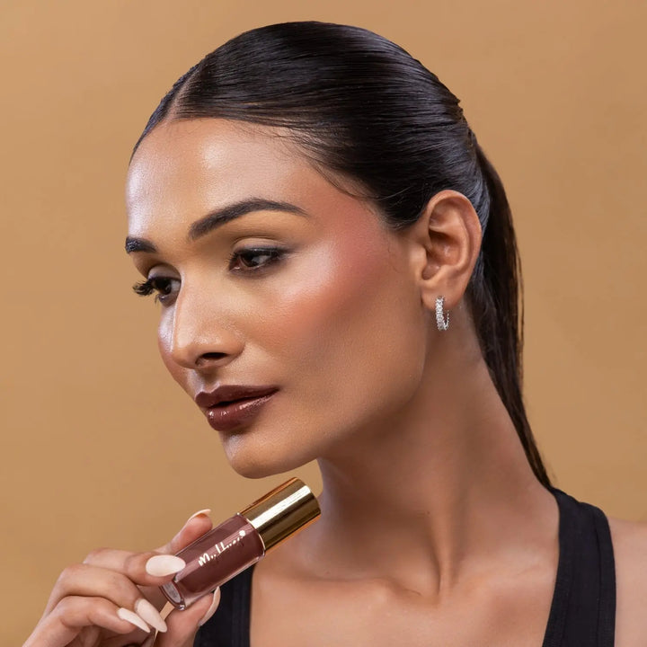 MyHues HyGlow Lip Elixir in Mira – rich brown lip gloss on medium Indian skin tone, high shine hydrating lip gloss with rich pigmentation and non sticky glossy finish