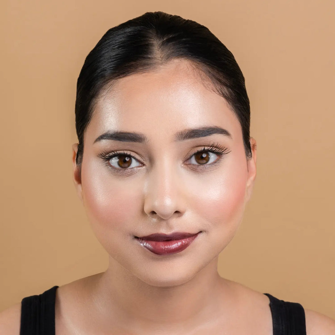 MyHues HyGlow Lip Elixir in Mira – rich brown lip gloss on fair Indian skin tone, high shine hydrating lip gloss with smooth glossy finish and even pigmentation
