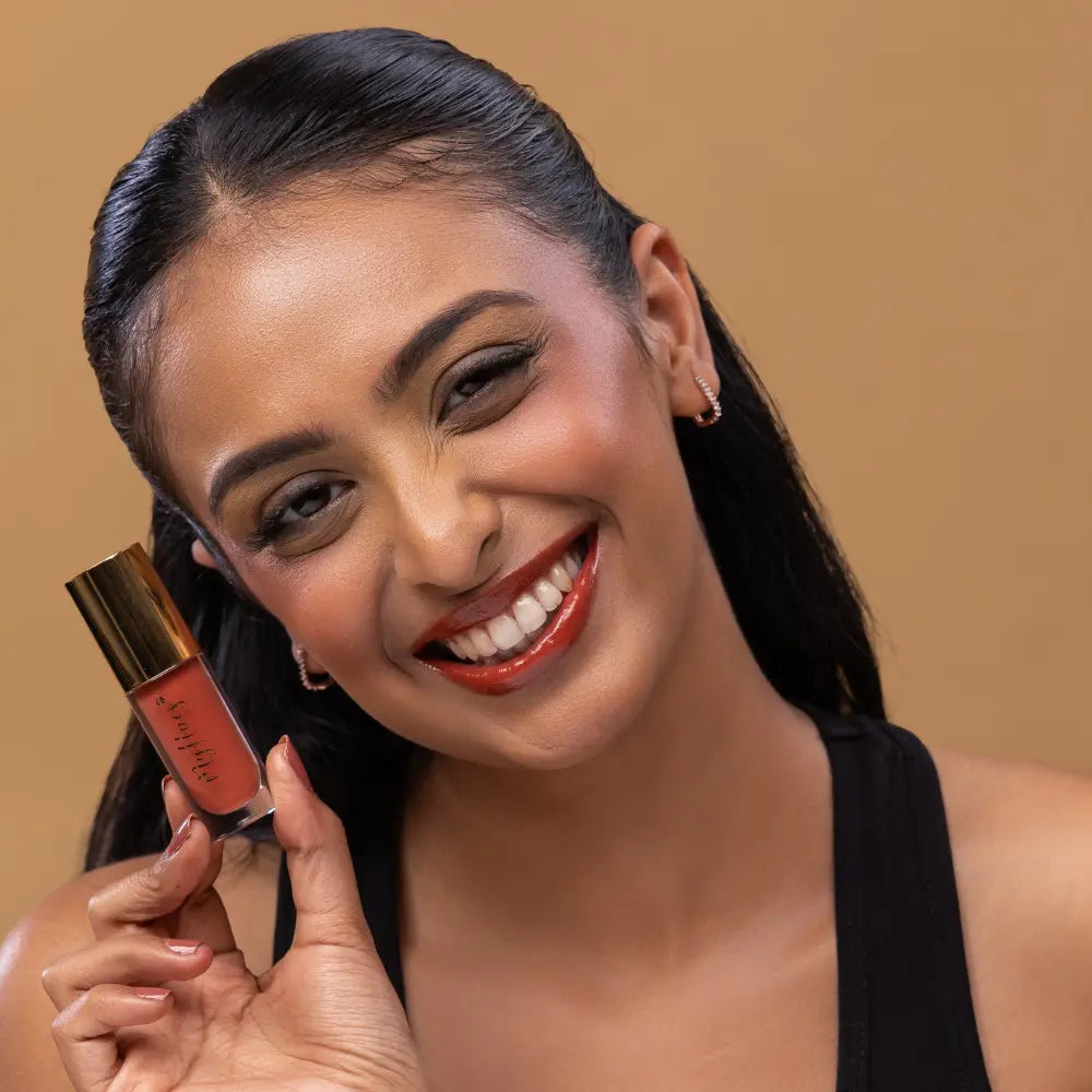 MyHues HyGlow Lip Elixir in Diya – terracotta brown lip gloss with rustic warm undertones on medium Indian skin tone, high shine hydrating lip gloss with rich pigmentation and non sticky glossy finish