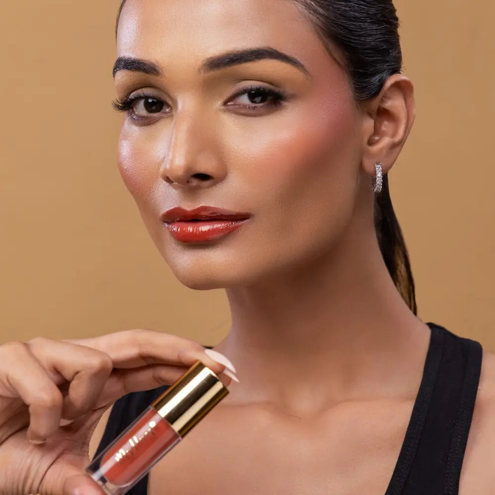 MyHues HyGlow Lip Elixir in Diya – terracotta brown lip gloss with rustic warm undertones on medium Indian skin tone, high shine hydrating lip gloss with rich pigmentation and non sticky glossy finish
