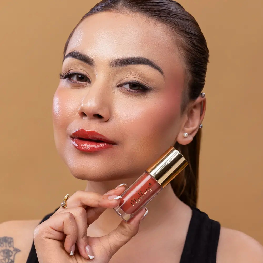 MyHues HyGlow Lip Elixir in Diya – terracotta brown lip gloss with rustic warm undertones on fair Indian skin tone, high shine hydrating lip gloss with smooth glossy finish and even pigmentation