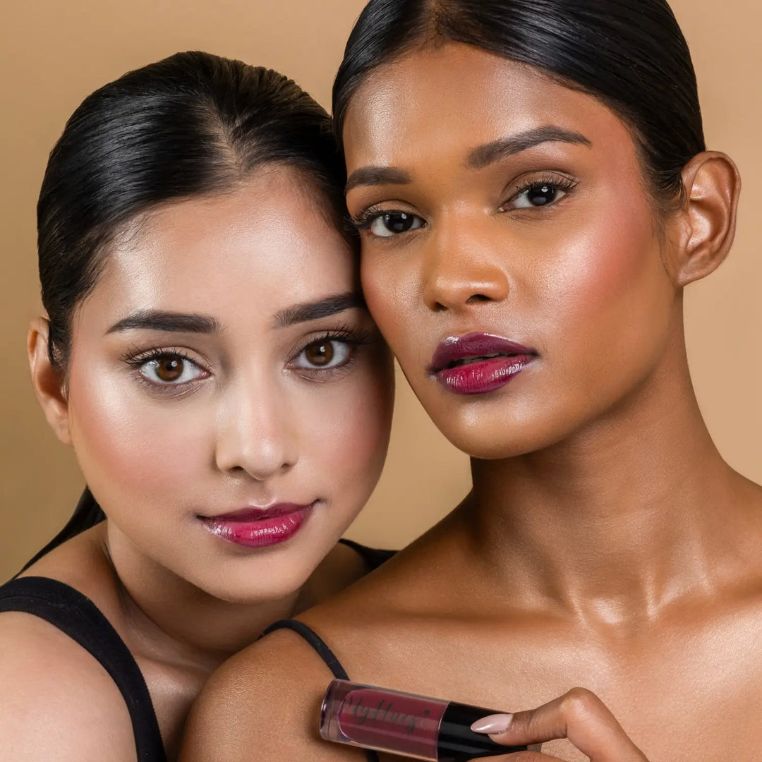 MyHues HyGlow Lip Elixir in Noor – deep burgundy lip gloss shown on fair and deep Indian skin tones, high shine hydrating lip gloss with rich pigmentation and smooth non sticky glossy finish