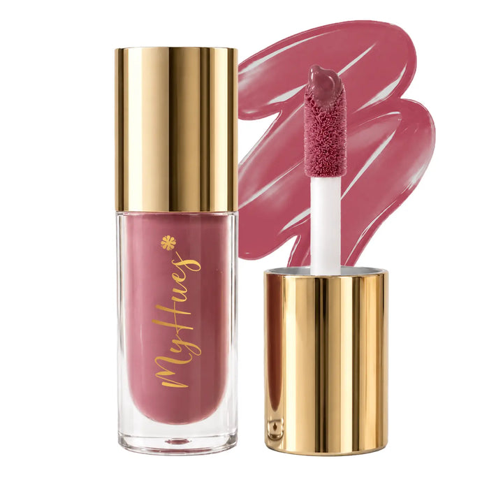 MyHues HyGlow Lip Elixir Rooh nude pink lip oil and lip gloss featuring premium gold packaging, plush doe-foot applicator and glossy nude pink swatch. Highly pigmented lip gloss with nourishing oils provides mirror-like shine, lightweight comfort and even colour for Indian skin tones.