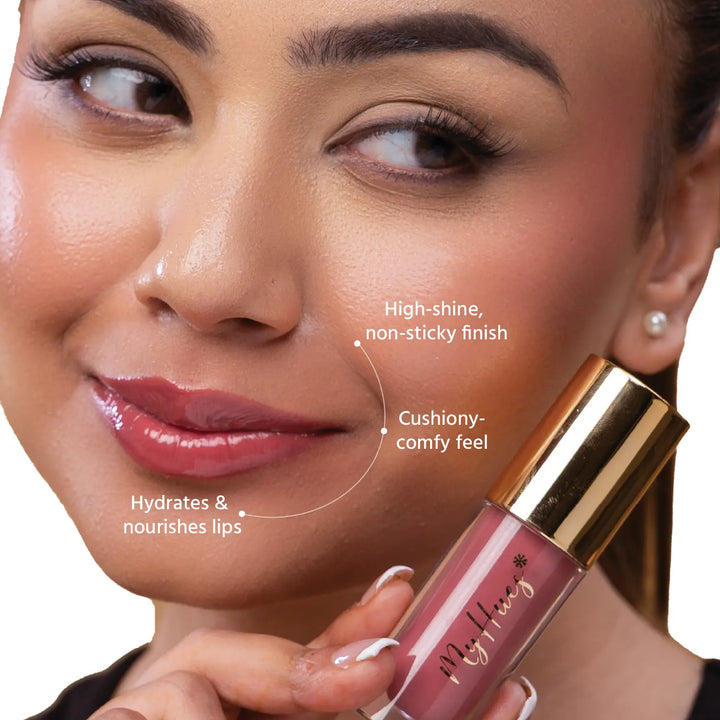 Close-up of an Indian model wearing MyHues HyGlow Lip Elixir Rooh, a nude pink glossy lip oil and lip gloss hybrid. The high-shine, non-sticky formula hydrates and nourishes lips while delivering a cushiony feel and rich colour that helps cover dark or pigmented lips.