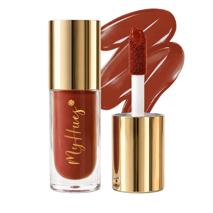 MyHues HyGlow Lip Elixir Diya warm terracotta brown lip oil and lip gloss featuring premium gold packaging, plush doe-foot applicator and glossy terracotta brown swatch. Highly pigmented lip gloss with nourishing oils provides mirror-like shine, lightweight comfort and rich colour for Indian skin tones.