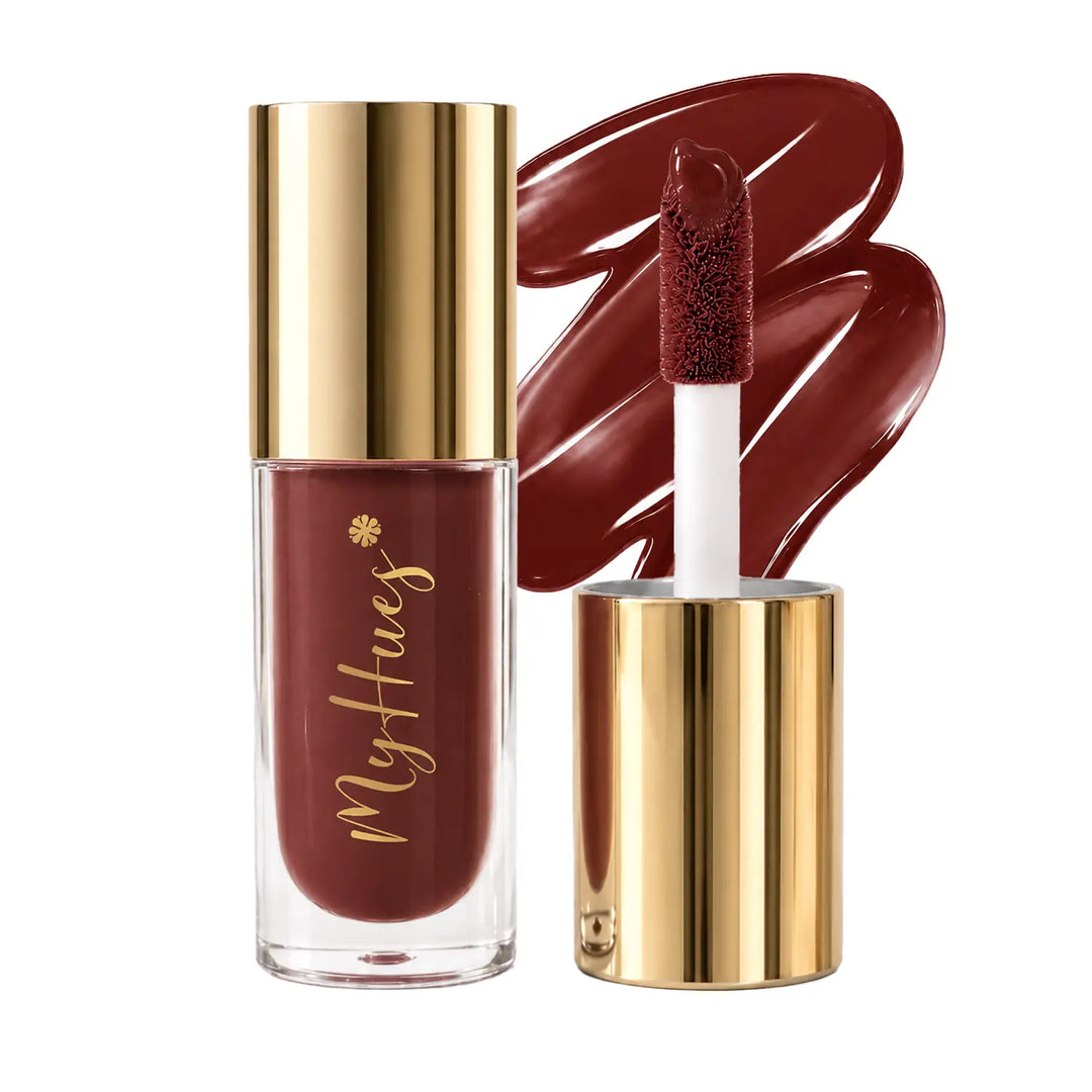 MyHues HyGlow Lip Elixir Mira rich brown lip oil and lip gloss featuring premium gold packaging, plush doe-foot applicator and glossy brown swatch. Highly pigmented lip gloss with nourishing oils provides mirror-like shine, lightweight comfort and rich colour suitable for all Indian skin tones.
