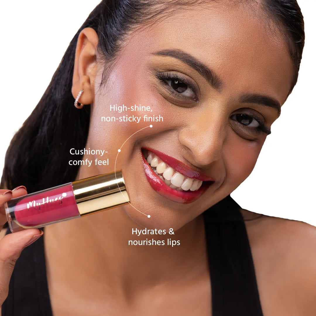 Close-up of an Indian model wearing MyHues HyGlow Lip Elixir Yana, a warm rose pink glossy lip oil and lip gloss hybrid. High-shine, non-sticky formula hydrates and nourishes lips while delivering a cushiony feel and vibrant colour that helps cover dark or pigmented lips.