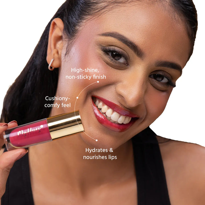 Close-up of an Indian model wearing MyHues HyGlow Lip Elixir Yana, a warm rose pink glossy lip oil and lip gloss hybrid. High-shine, non-sticky formula hydrates and nourishes lips while delivering a cushiony feel and vibrant colour that helps cover dark or pigmented lips.